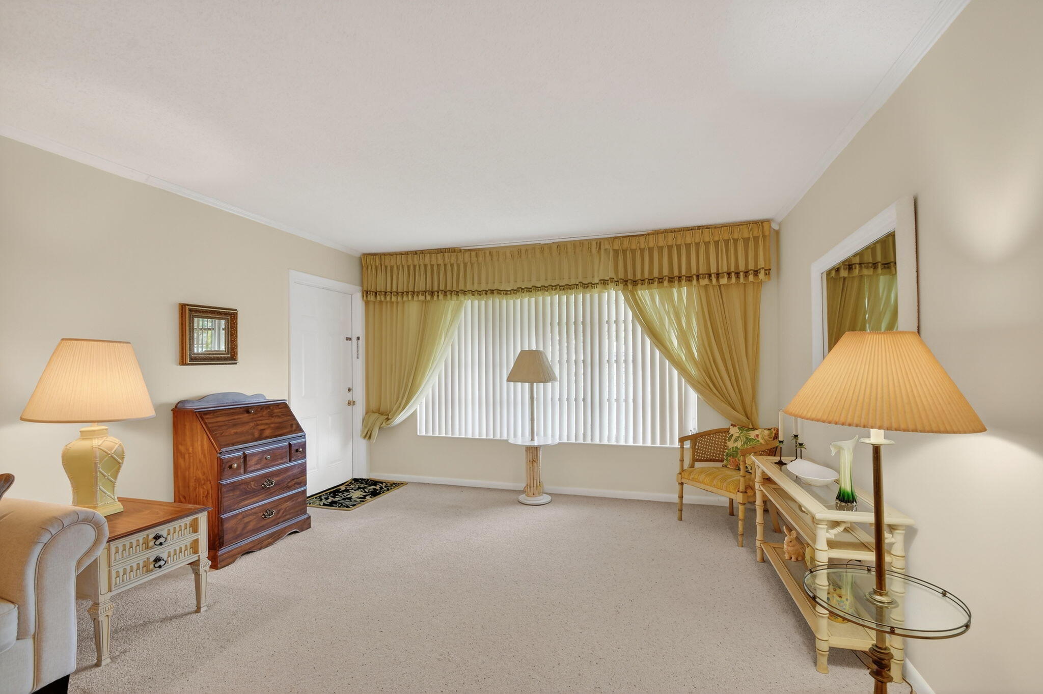 615 High Point Drive, Unit C Delray Beach, FL 33445 - Photo 7 of 48 a living room with a couch and a table