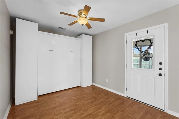 a view of a livingroom with wooden floor