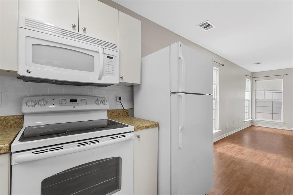 20602 Hackberry Creek Park Road Frisco, TX 75036 - Photo 10 of 20 a stove top oven sitting inside of a kitchen