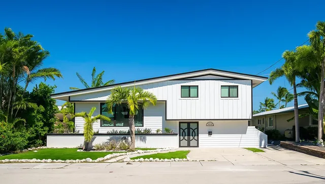 a front view of a house with a garden and porch