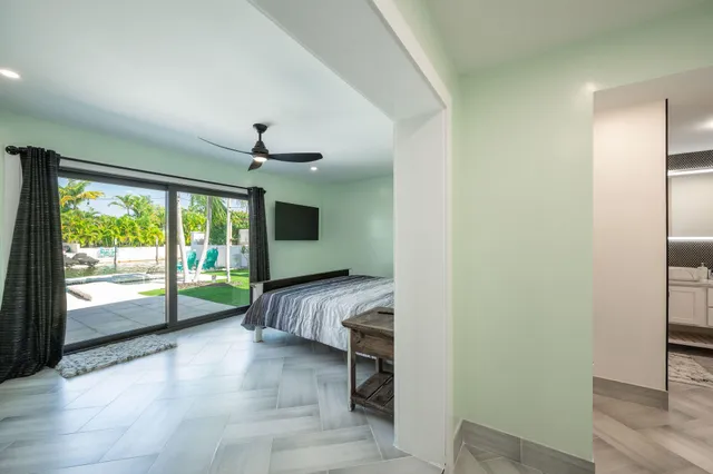 a view of living room with patio furniture and a fireplace