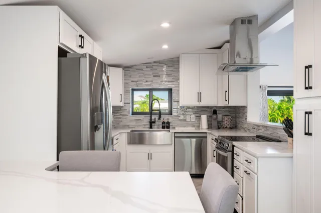 a view of a lake with couches chairs