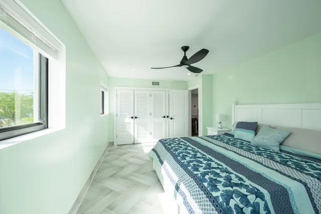 a view of a house with swimming pool and sitting area