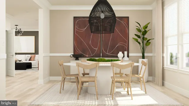 a view of a dining room with furniture and a potted plant