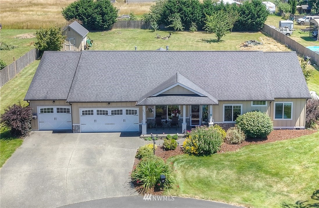 8422 180th Way Southwest Rochester, WA 98579 - Photo 2 of 34 an aerial view of a house with a yard