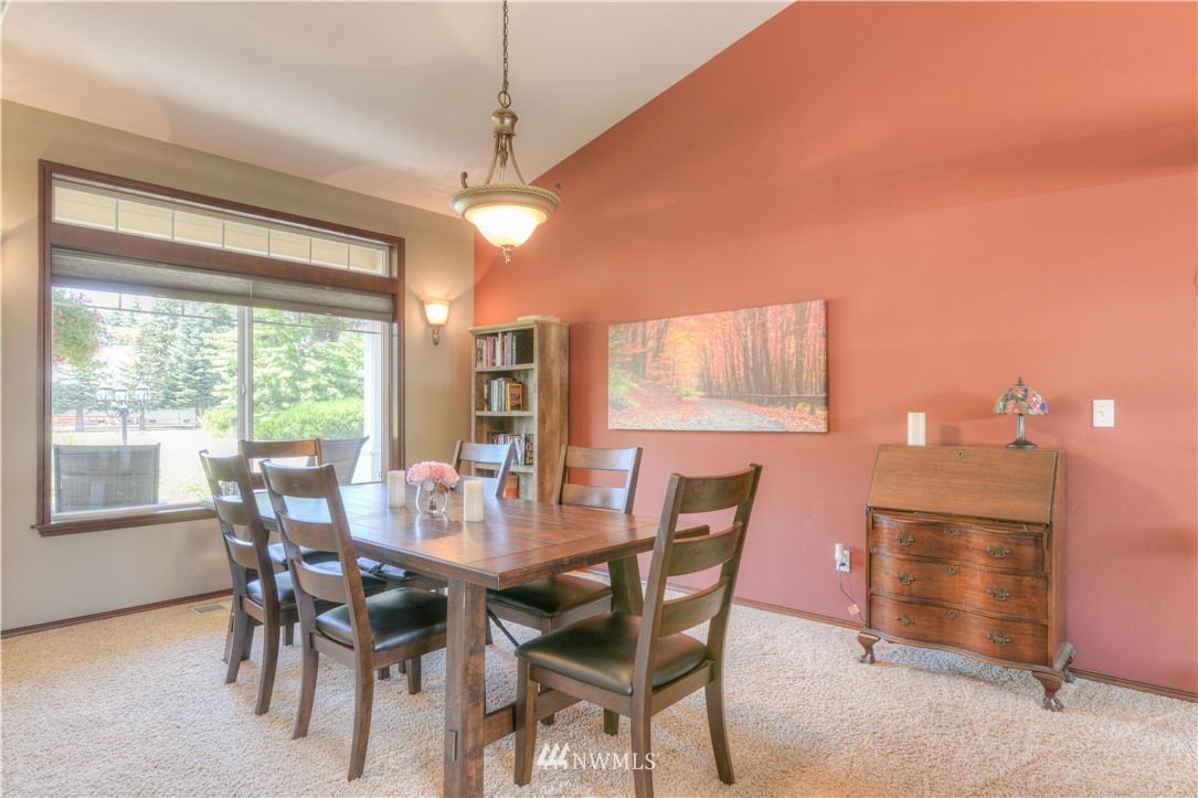 8422 180th Way Southwest Rochester, WA 98579 - Photo 16 of 34 a view of a dining room with furniture window and outside view
