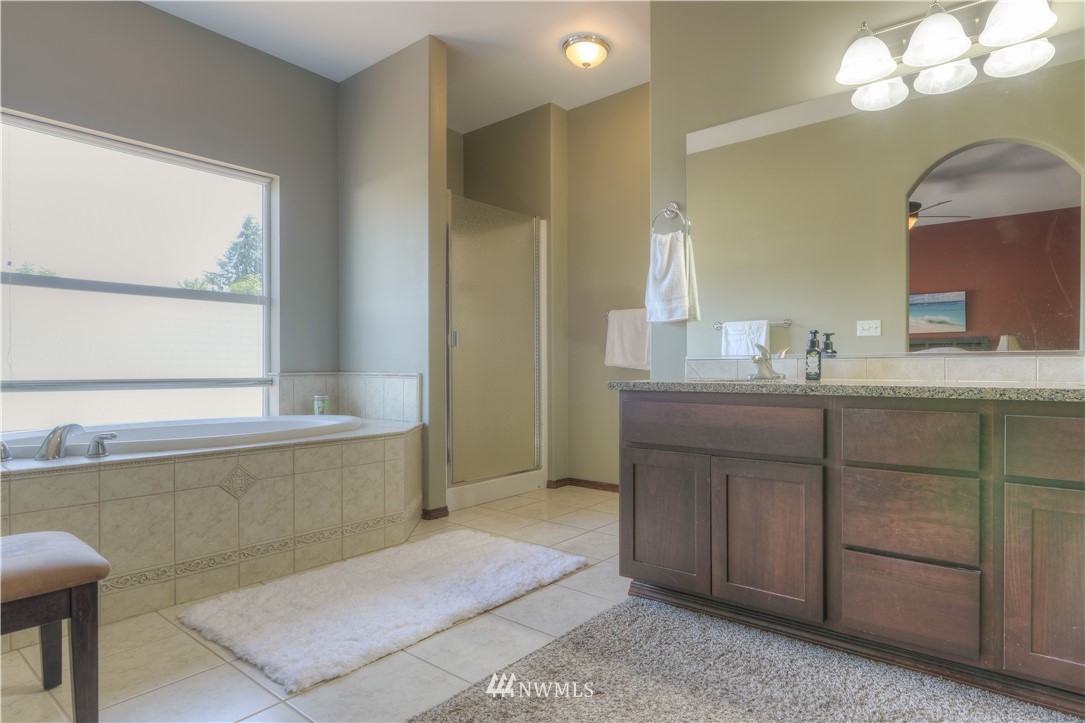 8422 180th Way Southwest Rochester, WA 98579 - Photo 24 of 34 a bathroom with a sink and a mirror