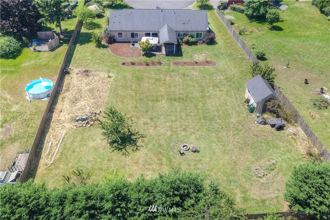 8422 180th Way Southwest Rochester, WA 98579 - Photo 32 of 34 an aerial view of a house with yard