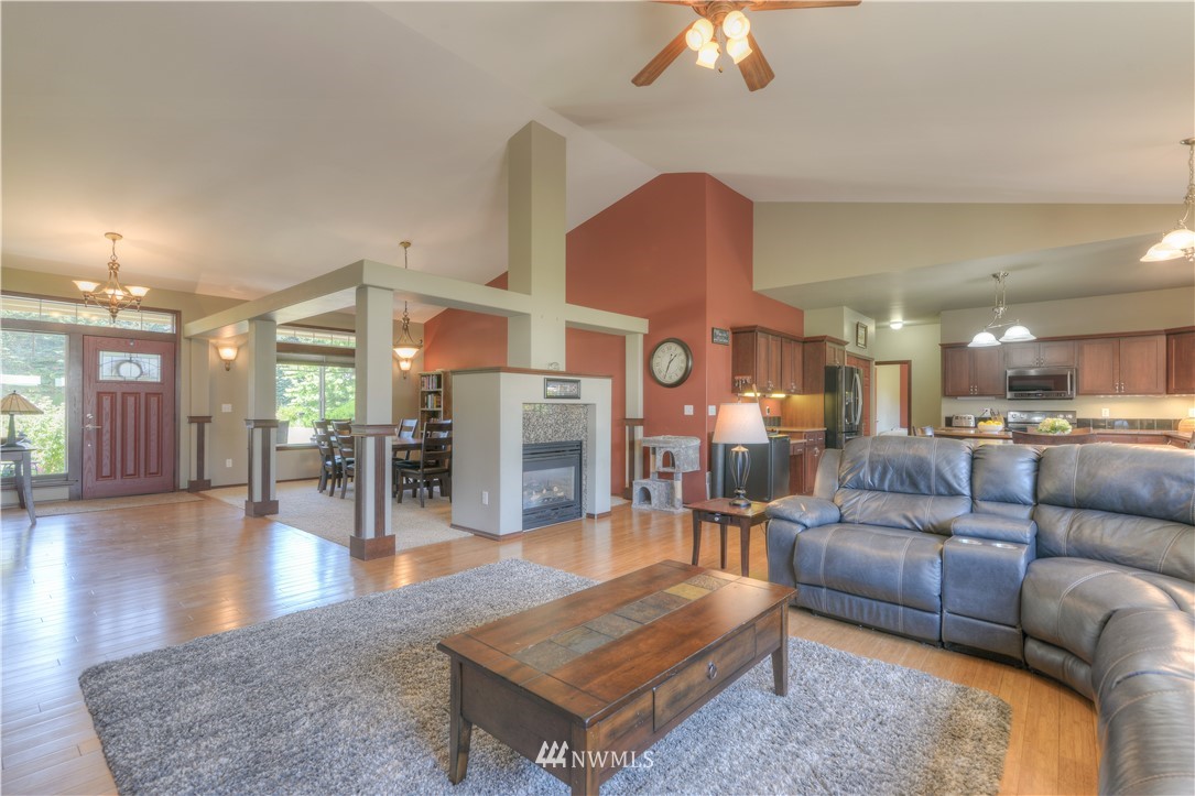 8422 180th Way Southwest Rochester, WA 98579 - Photo 5 of 34 a living room with furniture and wooden floor