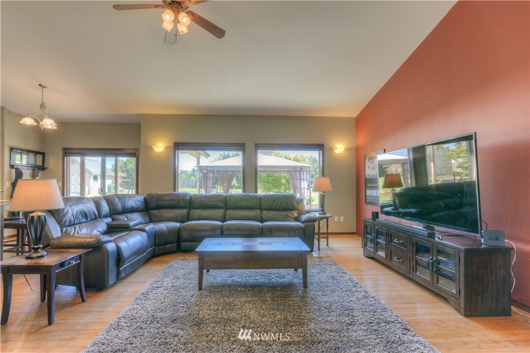 8422 180th Way Southwest Rochester, WA 98579 - Photo 6 of 34 a living room with furniture and a flat screen tv