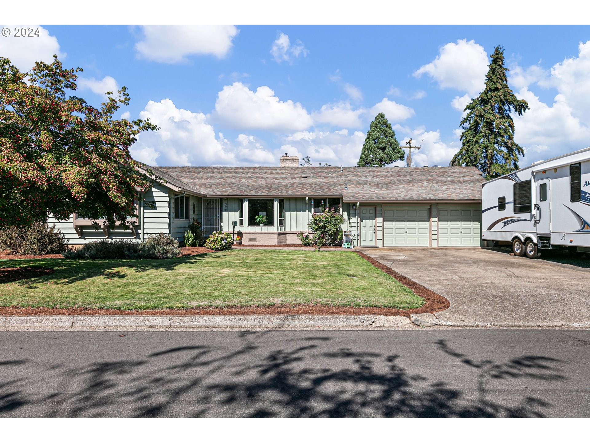 390 Cambridge Street Springfield, OR 97477 - Photo 1 of 48 a front view of a house with a yard