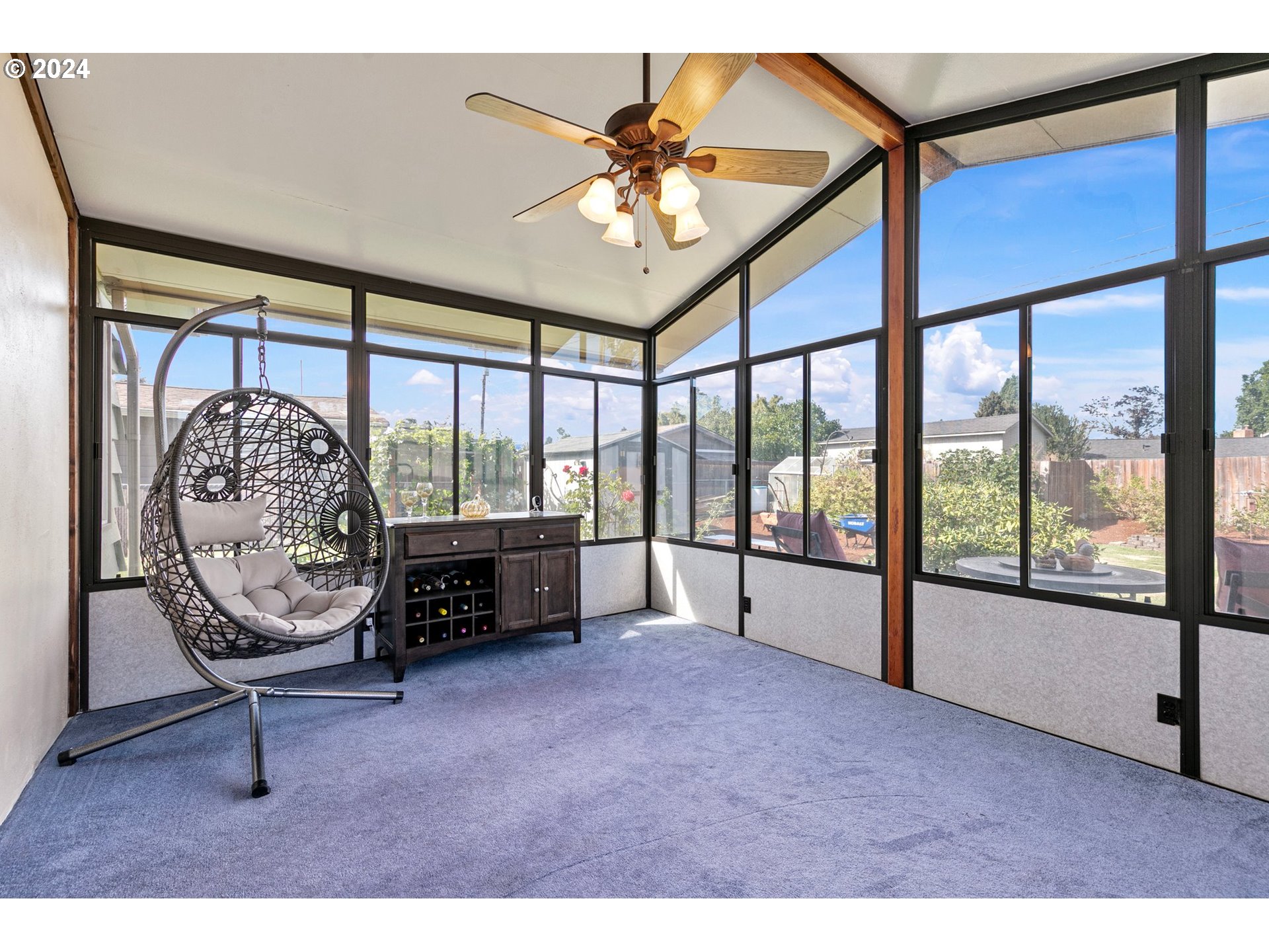 390 Cambridge Street Springfield, OR 97477 - Photo 29 of 48 a living room with furniture and a floor to ceiling window