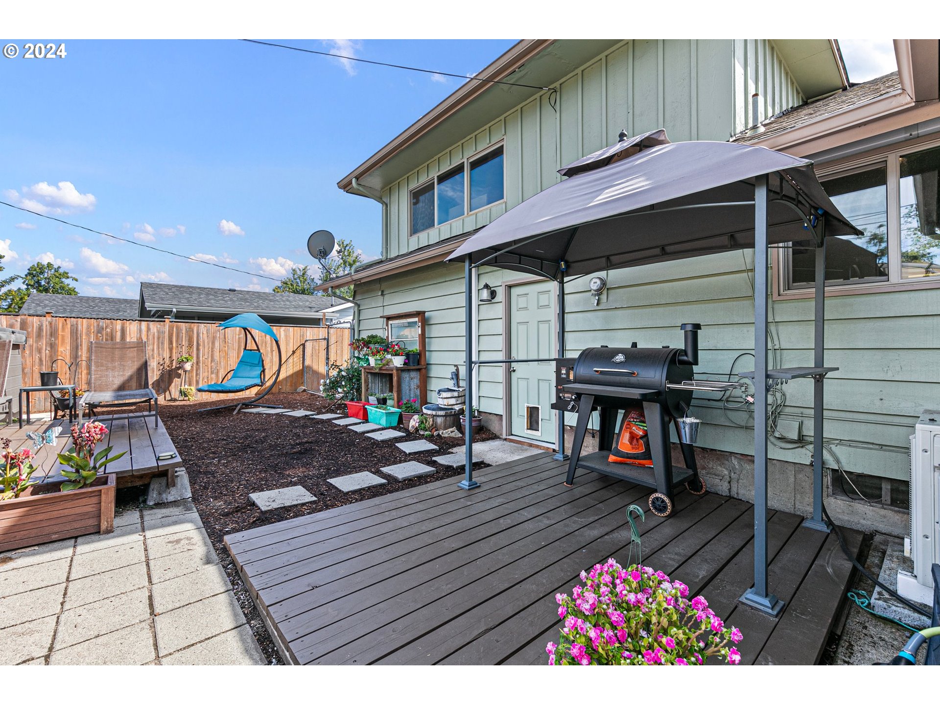 390 Cambridge Street Springfield, OR 97477 - Photo 30 of 48 a view of a chairs and table on the wooden deck