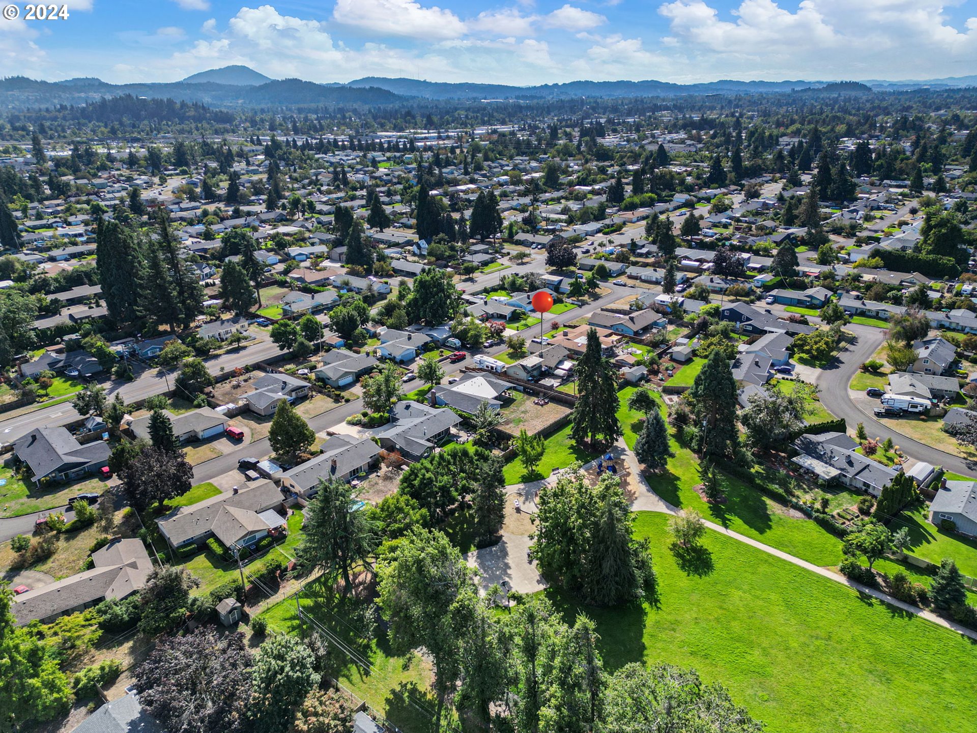 390 Cambridge Street Springfield, OR 97477 - Photo 42 of 48 an aerial view of residential houses with outdoor space and trees