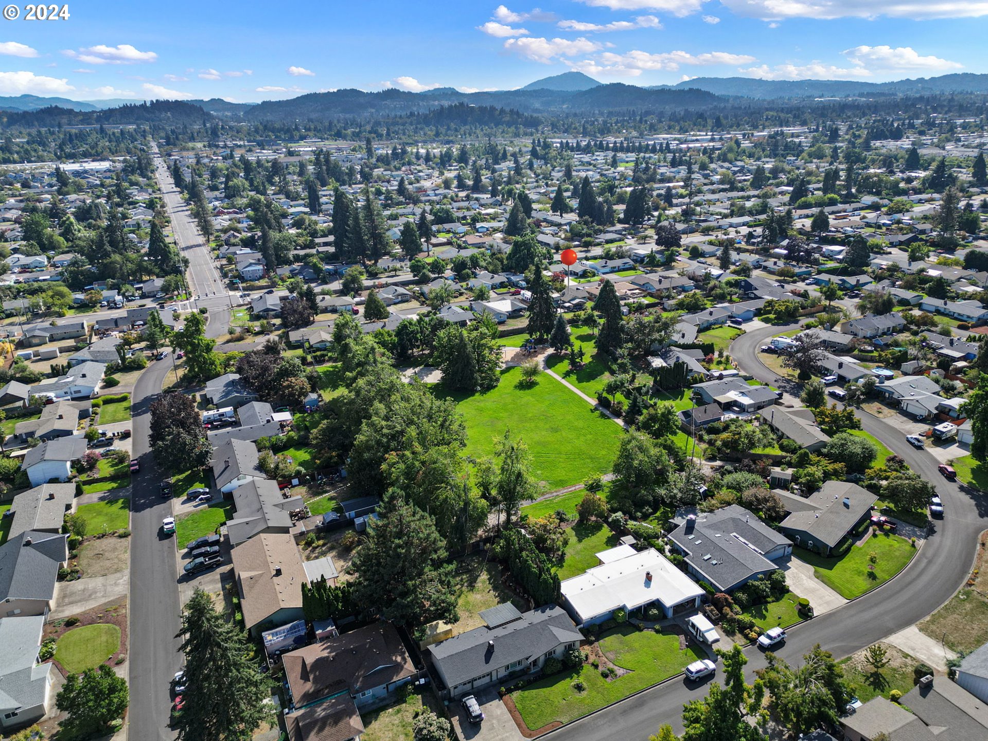 390 Cambridge Street Springfield, OR 97477 - Photo 43 of 48 an aerial view of residential houses with outdoor space and street view