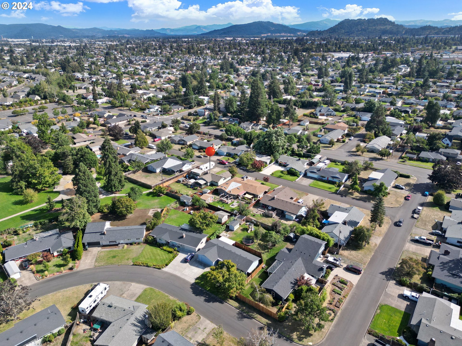 390 Cambridge Street Springfield, OR 97477 - Photo 44 of 48 an aerial view of a city with lots of residential buildings