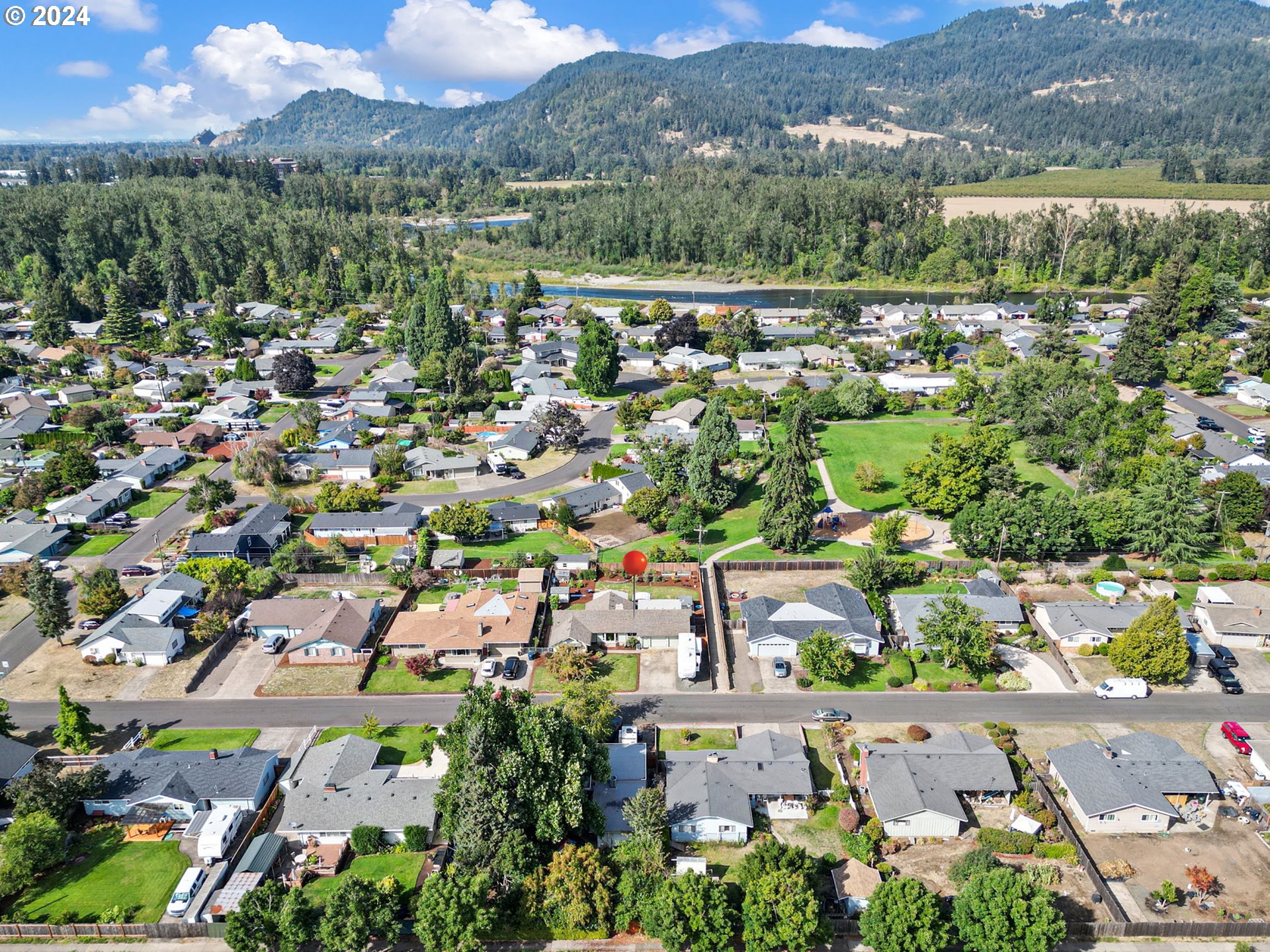 390 Cambridge Street Springfield, OR 97477 - Photo 46 of 48 an aerial view of a city with lots of residential buildings
