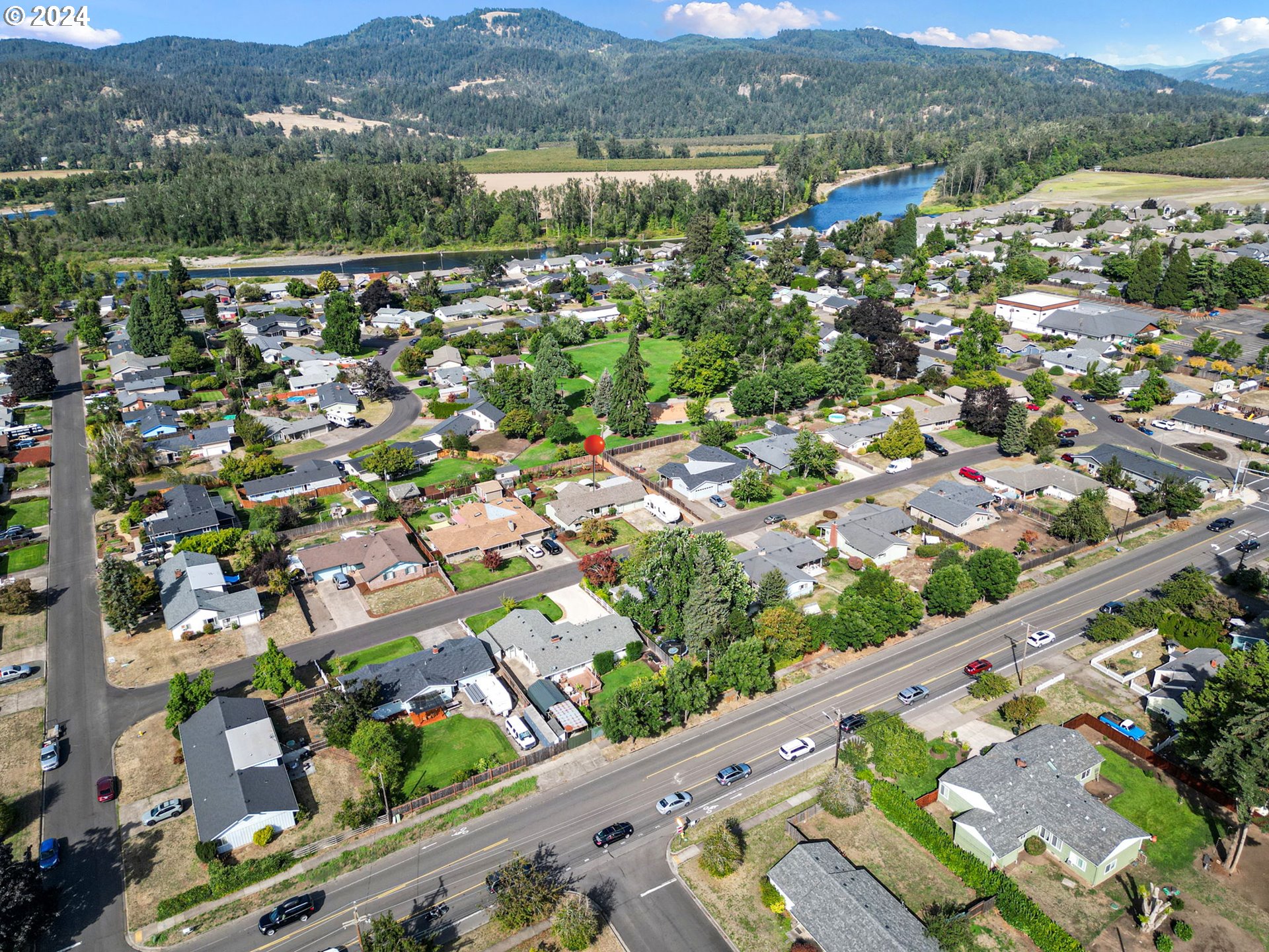 390 Cambridge Street Springfield, OR 97477 - Photo 48 of 48 an aerial view of a city with mountains