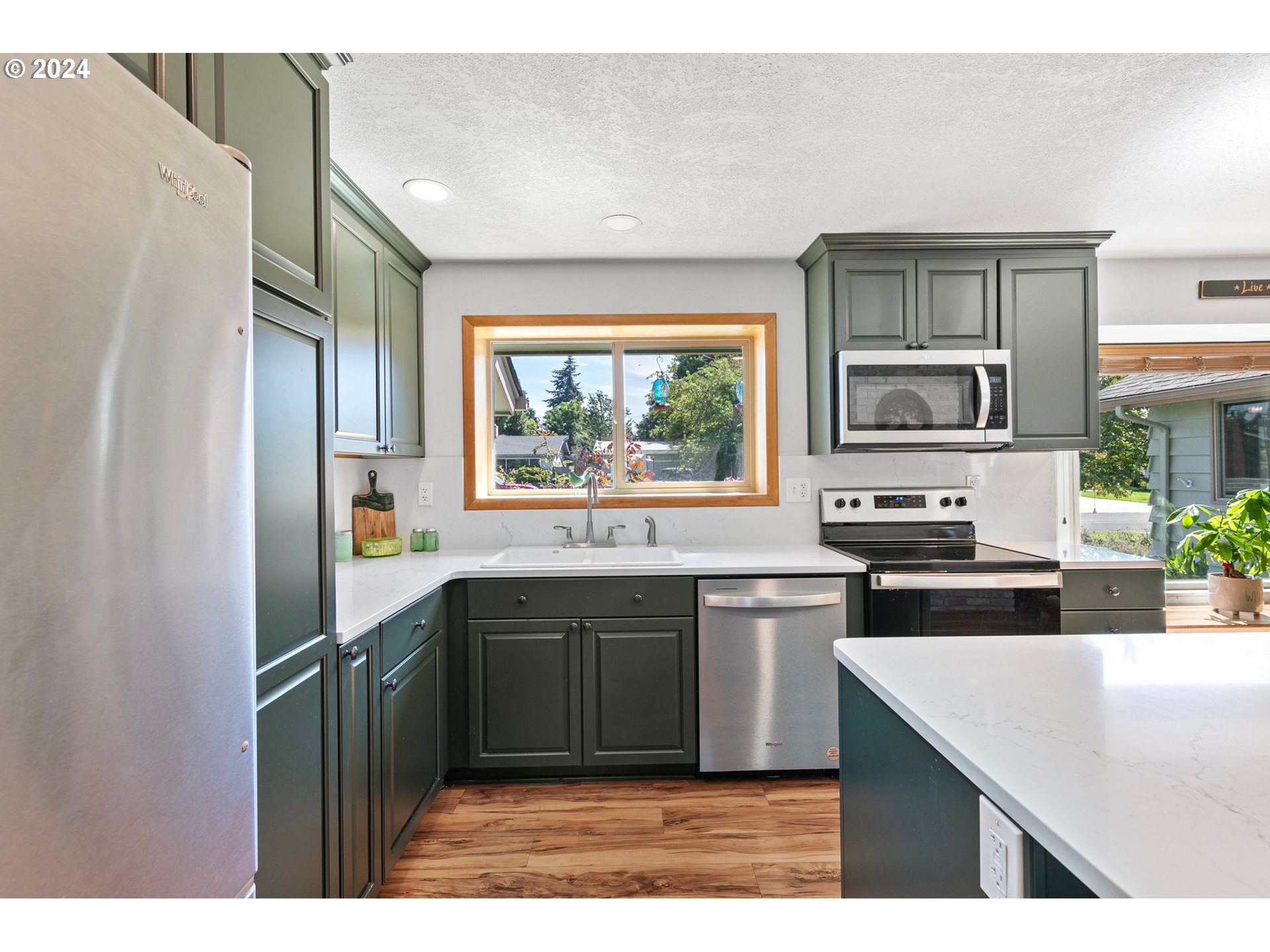 390 Cambridge Street Springfield, OR 97477 - Photo 9 of 48 a kitchen with a sink stove and refrigerator