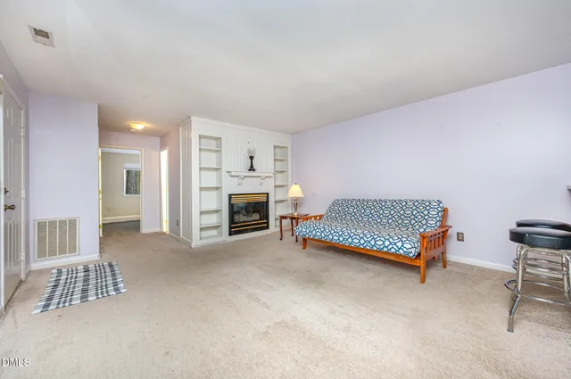 a bedroom with furniture and a fireplace