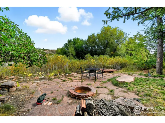 a view of a backyard with sitting area