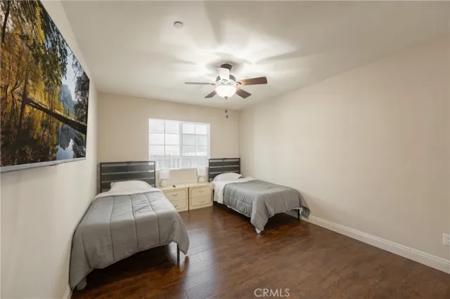 a bedroom with bed and a chandelier