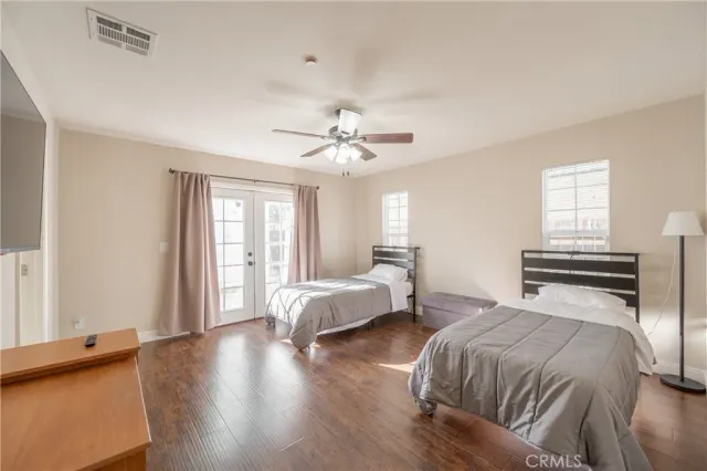 a spacious bedroom with a bed and a window