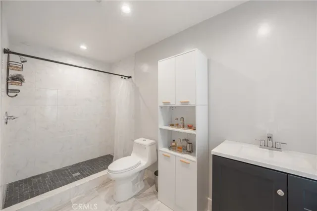 a front view of a multi story building with yard