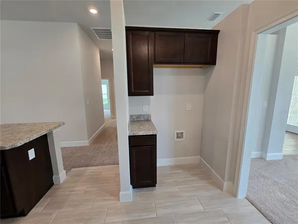 a view of entryway with a hallway and stairs