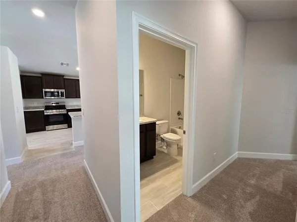 a view of a open kitchen and a window