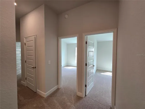 an empty room with mirror in closet