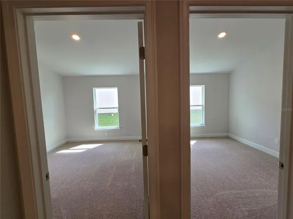 a view of a hallway with an empty room