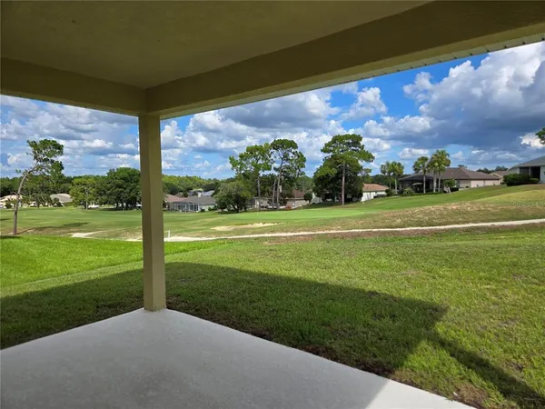 a view of a golf course with a big yard