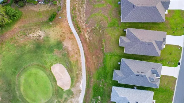 an aerial view of a house with a swimming pool