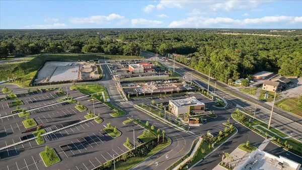 a view of a city with lots of residential buildings and mountain view in back
