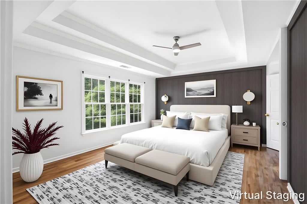 110 Mayes Farm Road Northwest Marietta, GA 30064 - Photo 23 of 49 a bedroom with a large bed and a couch