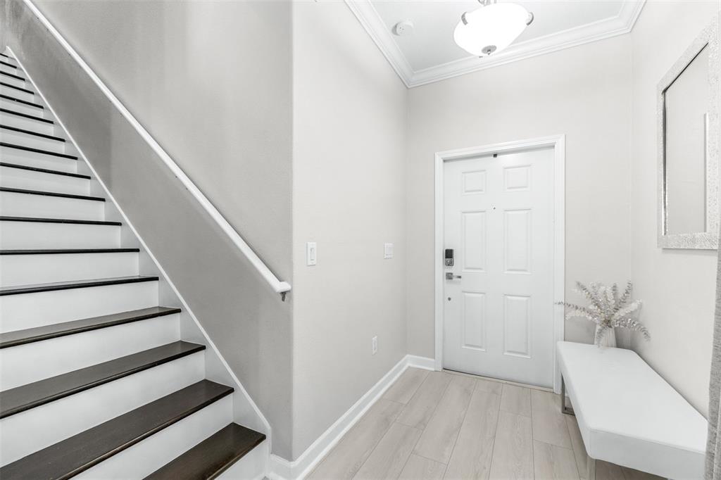 1762 Hadden Hall Place Trinity, FL 34655 - Photo 4 of 49 a view of entryway with stairs and wooden floor
