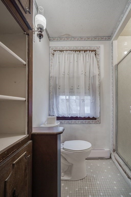 80 Embassy Road Springfield, MA 01119 - Photo 20 of 38 a bathroom with a toilet a sink and shower
