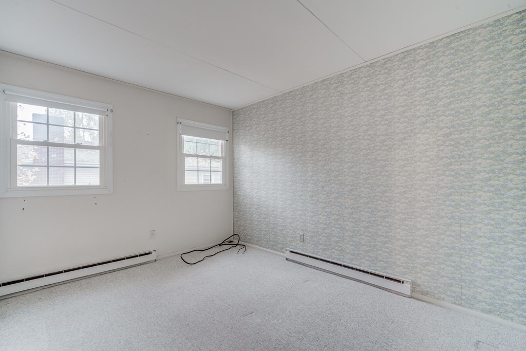 80 Embassy Road Springfield, MA 01119 - Photo 25 of 38 an empty room with windows
