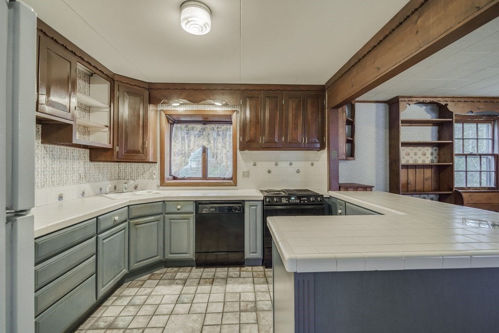 80 Embassy Road Springfield, MA 01119 - Photo 6 of 38 a kitchen with a sink a stove and cabinets
