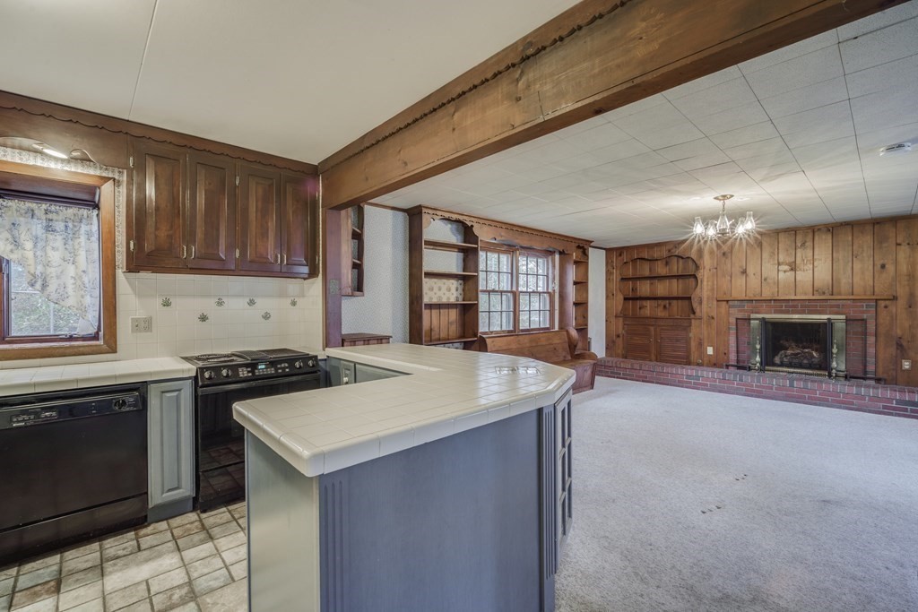 80 Embassy Road Springfield, MA 01119 - Photo 7 of 38 a kitchen with a stove a sink and a refrigerator