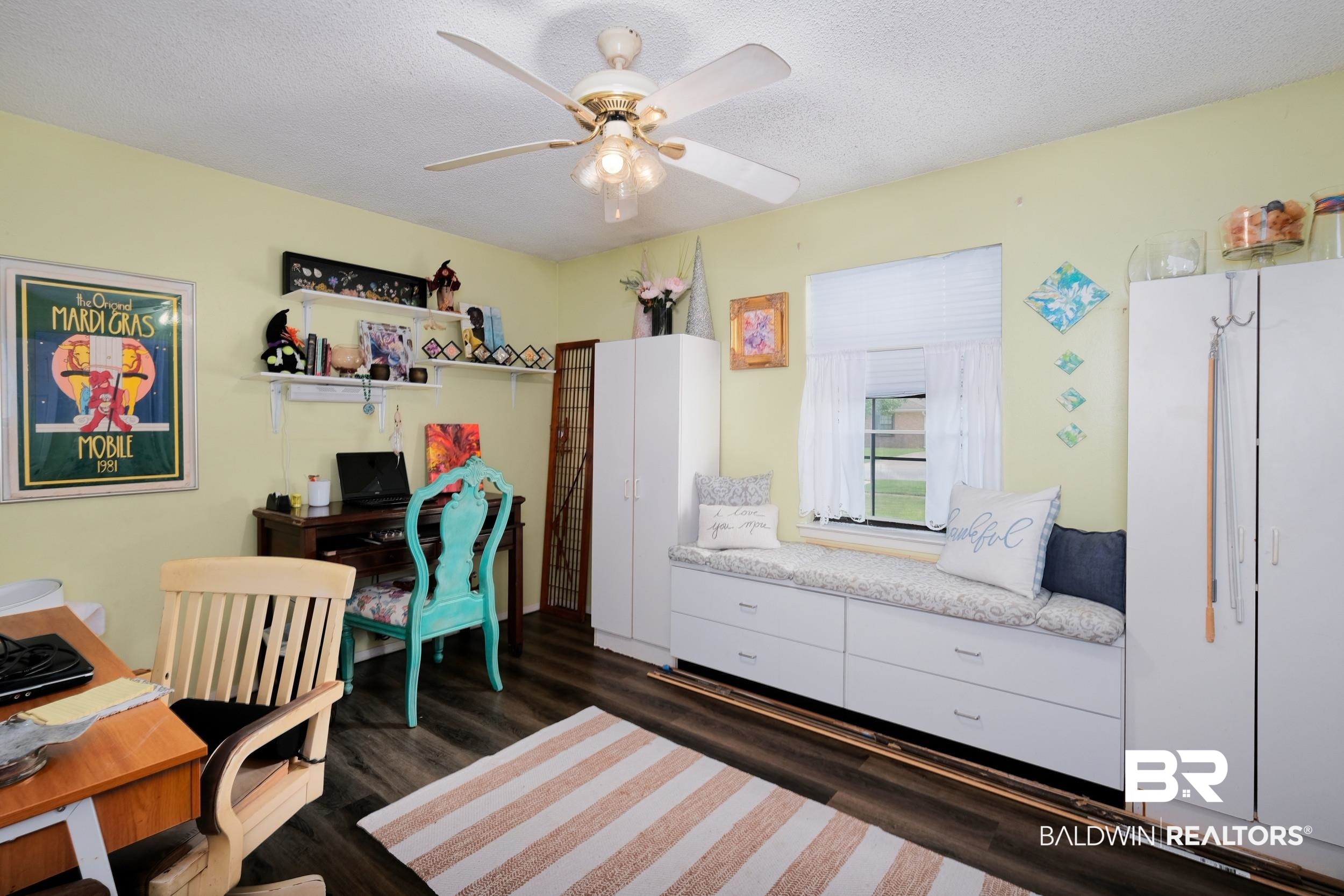 504 Ariel Avenue Foley, AL 36535 - Photo 31 of 33 Office space featuring dark hardwood / wood-style floors, a textured ceiling, and ceiling fan