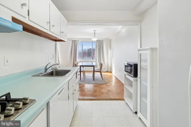 a kitchen with stainless steel appliances a refrigerator and a sink