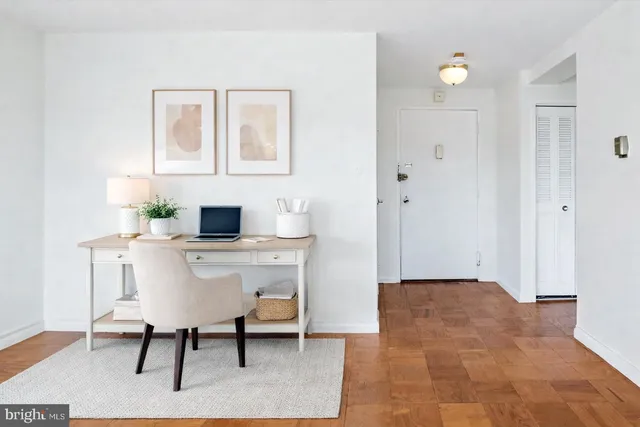 a workspace with furniture and window