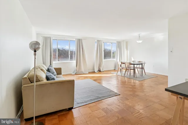 a living room with furniture and a table