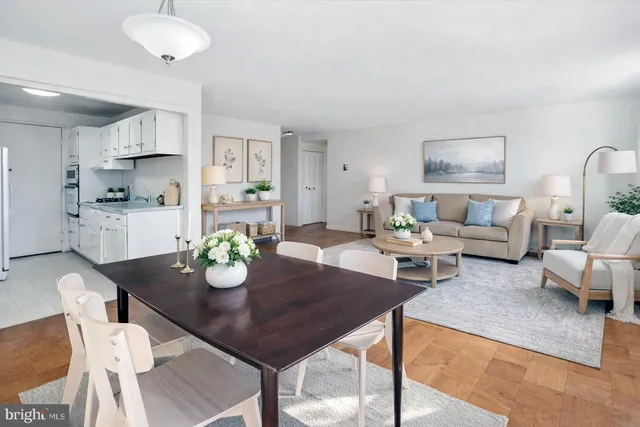a view of a dining room with furniture and wooden floor