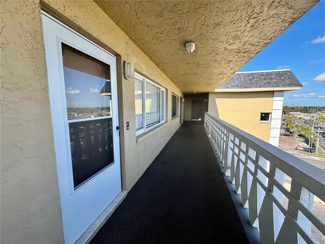 a kitchen with granite countertop kitchen island stainless steel appliances a stove a sink a refrigerator a stove a dining table and chairs