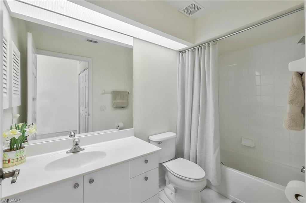 6812 Satinleaf Road South, Unit 204 Naples, FL 34109 - Photo 28 of 39 a bathroom with a sink toilet and shower