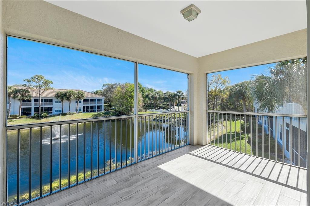 6812 Satinleaf Road South, Unit 204 Naples, FL 34109 - Photo 29 of 39 a balcony with wooden floor