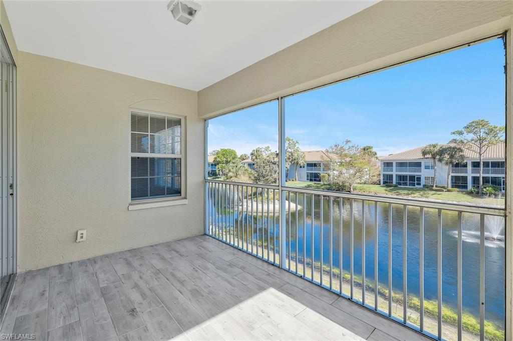 6812 Satinleaf Road South, Unit 204 Naples, FL 34109 - Photo 30 of 39 a view of a balcony with city view